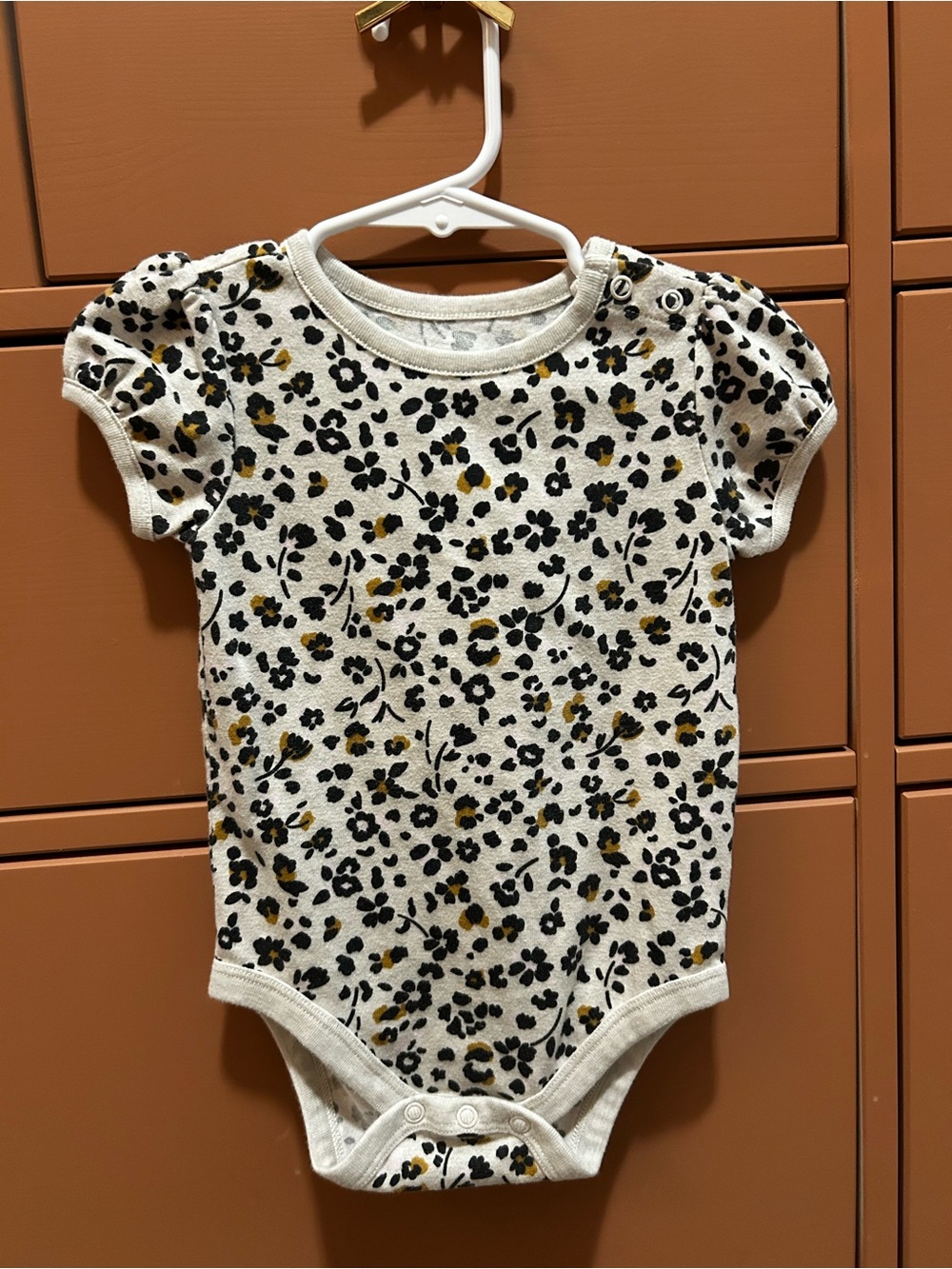 Garanimals Cream One-Piece Bodysuit with Black and Mustard Floral Leopard Print
